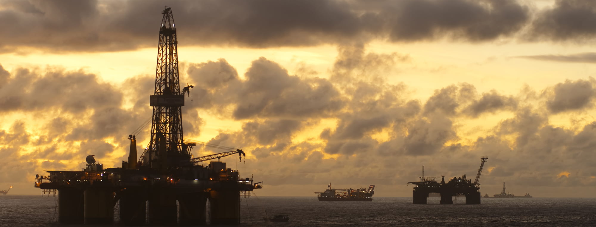 Offshore oil field at sunset